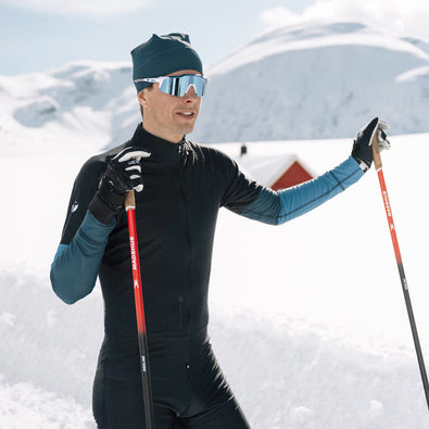 Man posing on skis in Vision competition racesuit from Trimtex