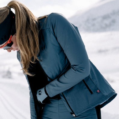 Woman getting ready for skiing, wearing Trimtex Ace Primaloft skiing Jacket.