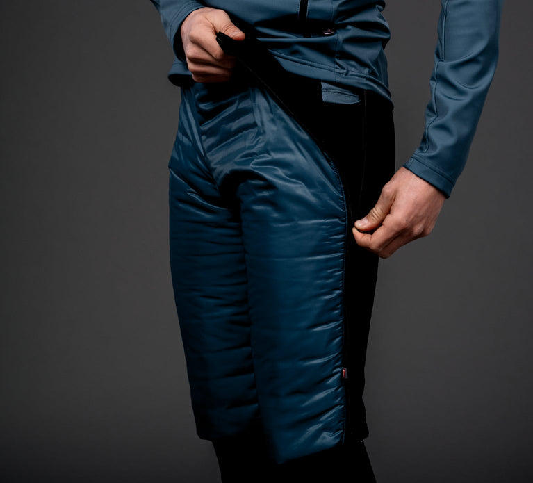 Skiier adjusting his Trimtex Ace Primaloft skiing shorts.