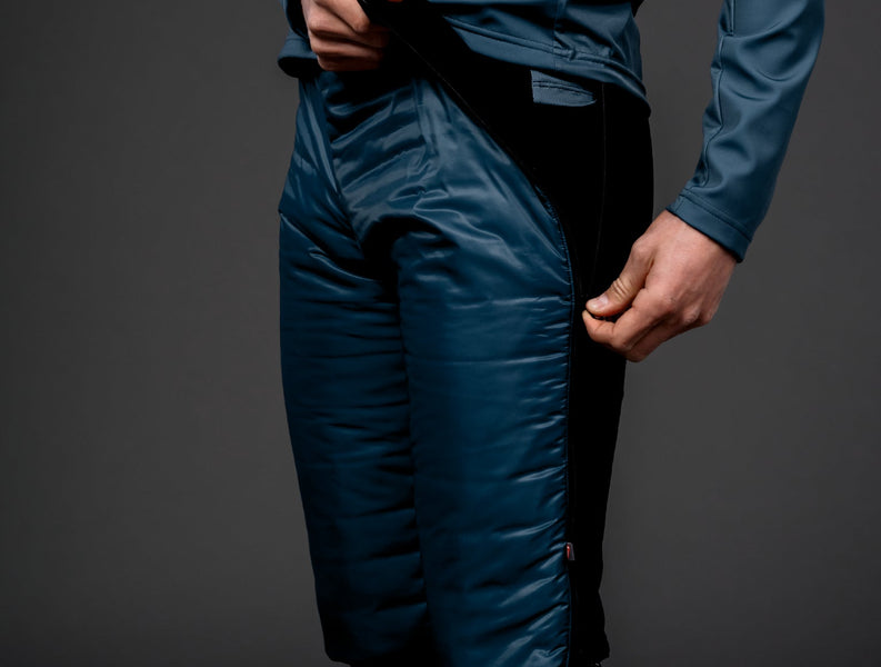 Skiier adjusting his Trimtex Ace Primaloft skiing shorts.