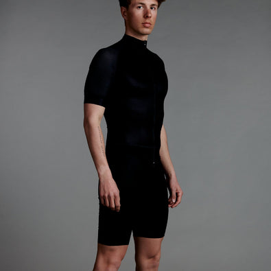 Man standing in studio with short Trimtex Ace skiing suit.