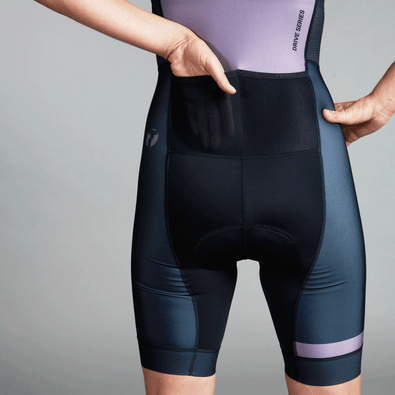 closeup studiophoto of triathlete showing the two gel pockets on her Trimtex Drive Speedsuit