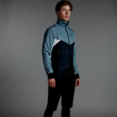 Studio photo of a skiier wearing Trimtex Pulse Jacket and Shorts.