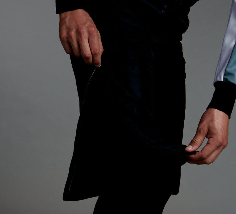 Studio photo of man in Trimtex Pulse Shorts, showing that the zipper is reaching up to the upper thigh.