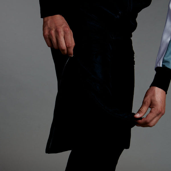 Studio photo of man in Trimtex Pulse Shorts, showing that the zipper is reaching up to the upper thigh.