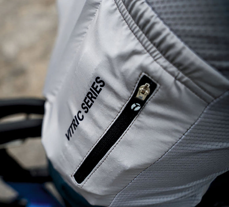 Vitric cycling shirt worn by a triathlete. Zoomed in shot of back pocket.