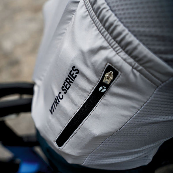 Vitric cycling shirt worn by a triathlete. Zoomed in shot of back pocket.